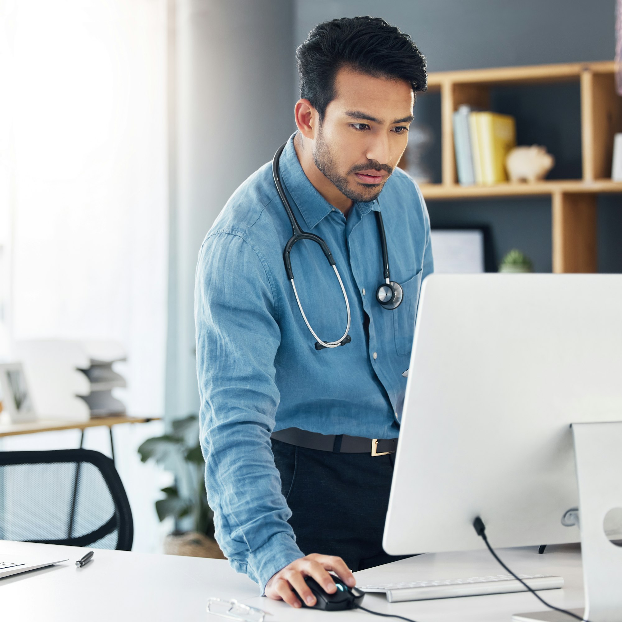 Healthcare, man doctor and computer research, healthcare innovation or planning online. Medical wor